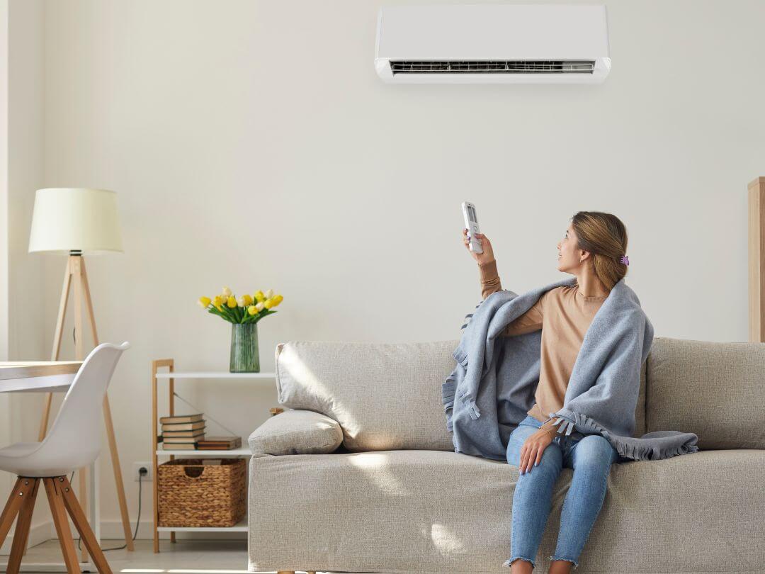 woman-using-ac-in-home-solutions